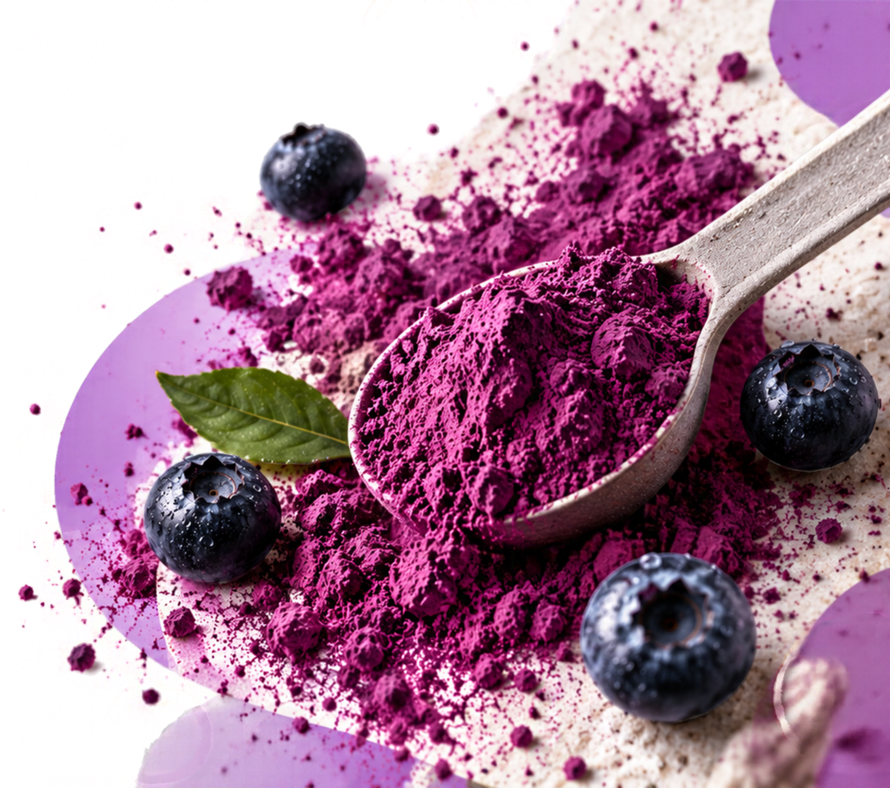 Spoon heaped with magenta blueberry powder beside a mound of powder, fresh blueberries and a green leaf on soft lilac shapes.